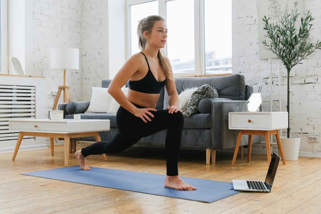 Woman doing online yoga class